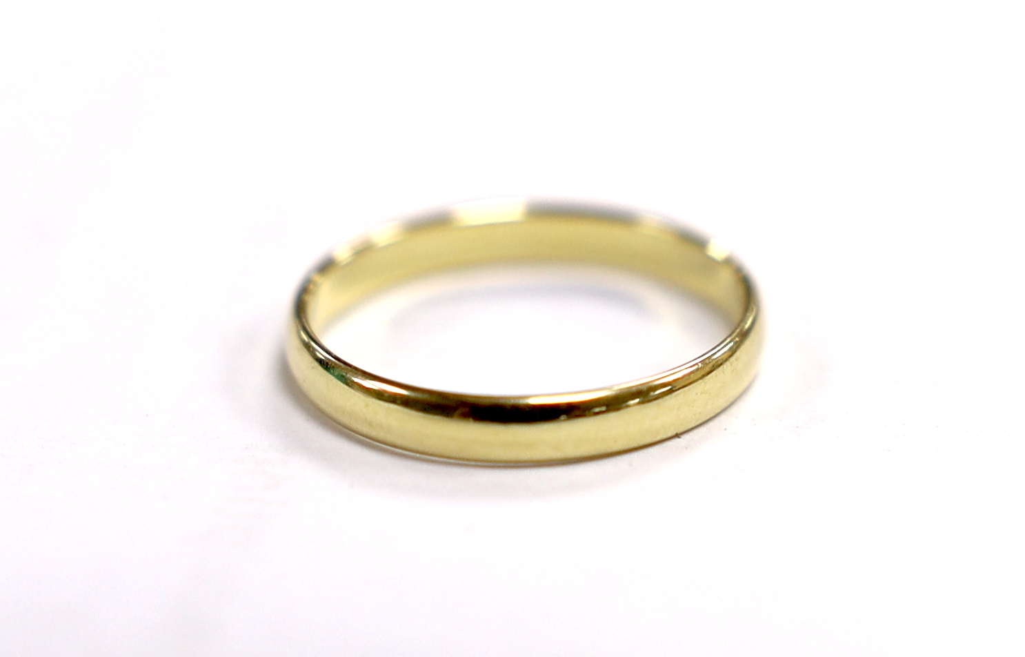 A 585 yellow metal wedding band, size M/N, 1.6 grams.